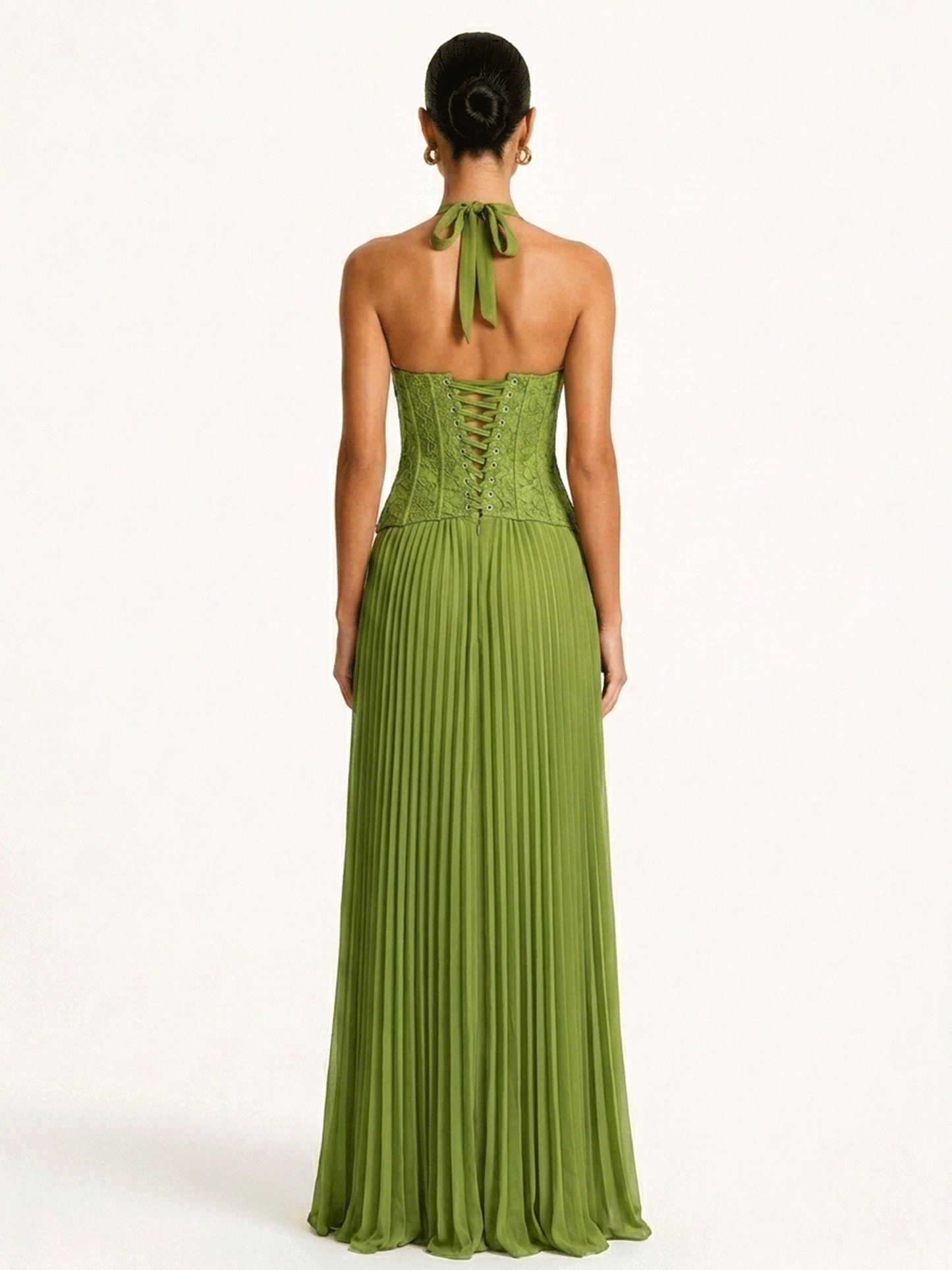 Back view of the green halter gown showing the open back