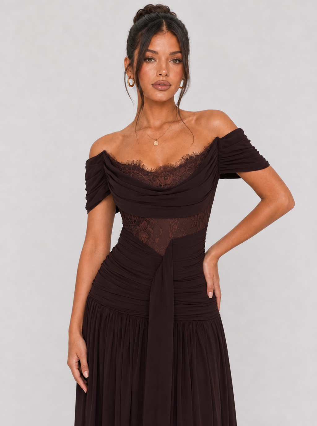 Close-up of the lace-trim bodice and sheer waist panel in brown
