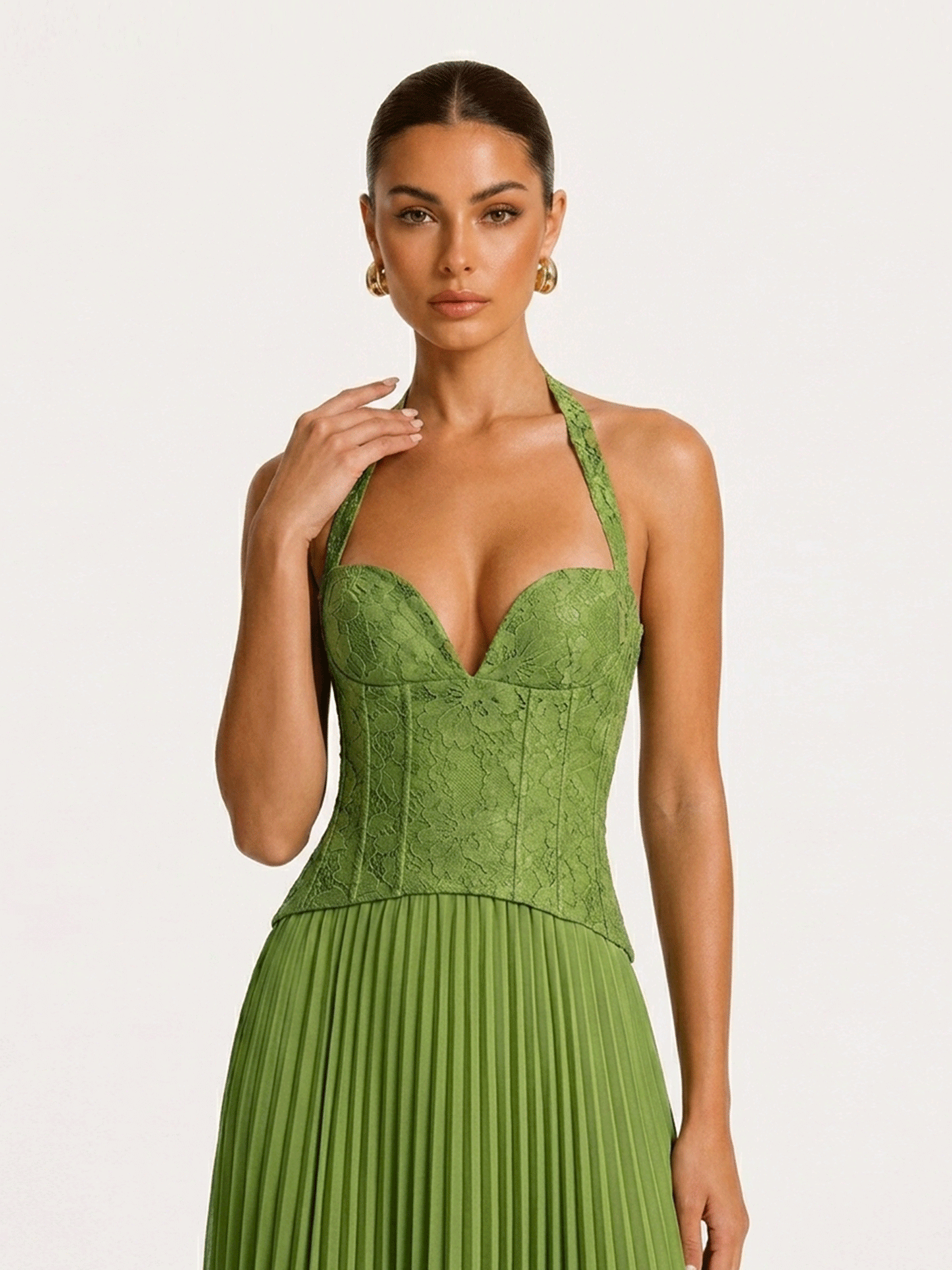 Close-up of the sweetheart corset bodice and halter neckline in green