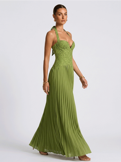 Green pleated chiffon gown seen from the side, full length